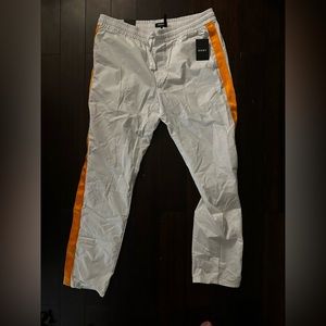 DKNY white and yellow type jogger
